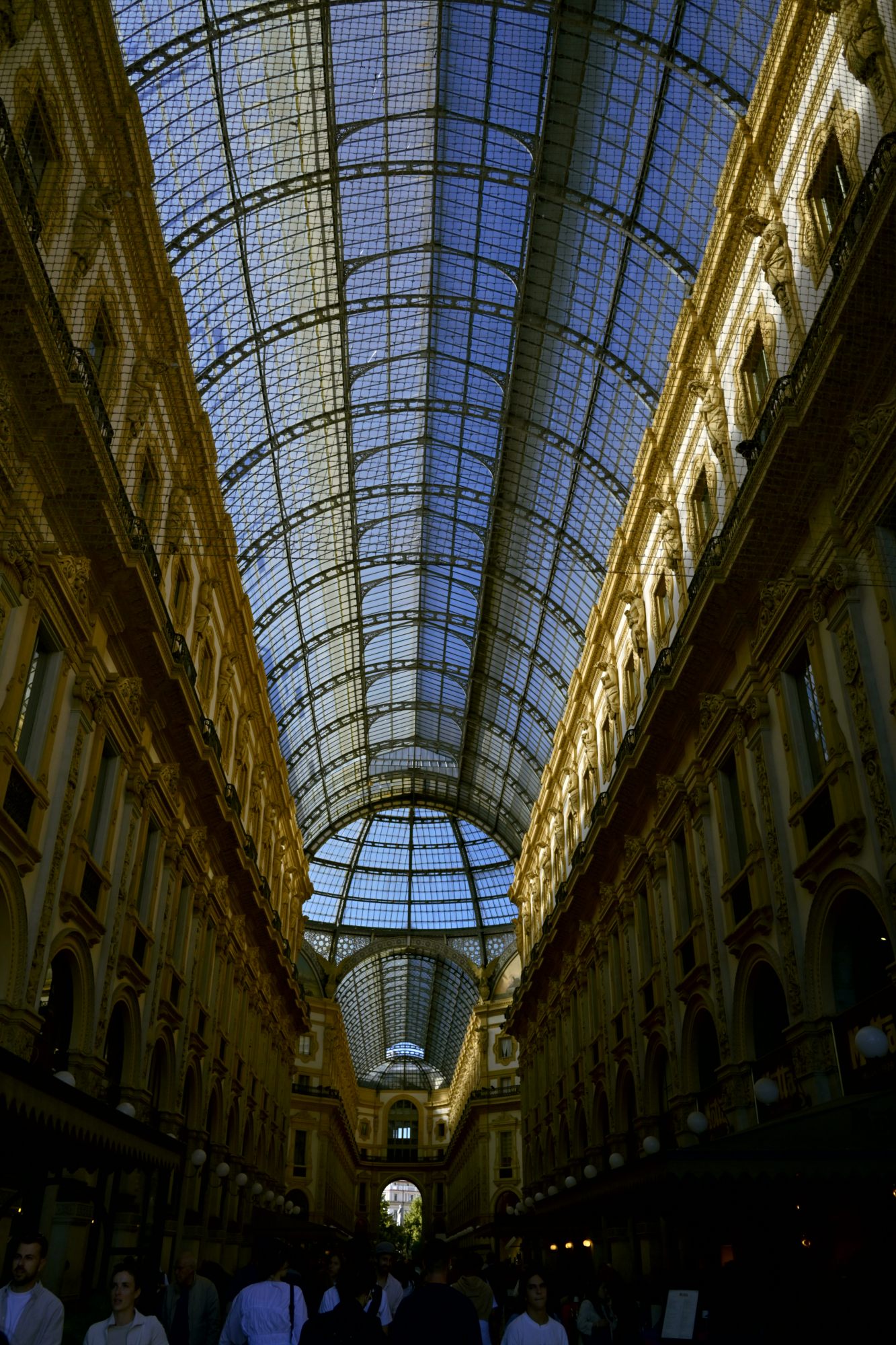 The glass vault of the Galleria seen from below.
