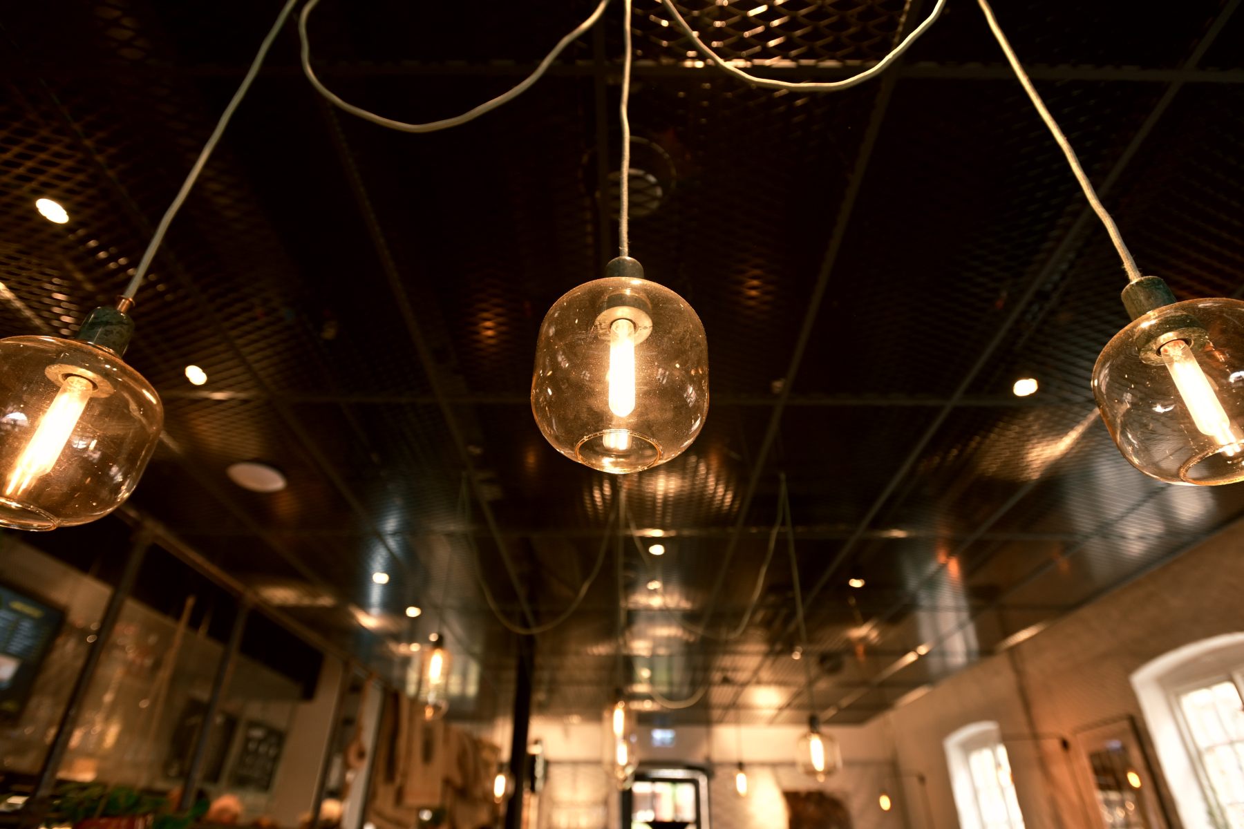 Pendant lights over an evening interior.